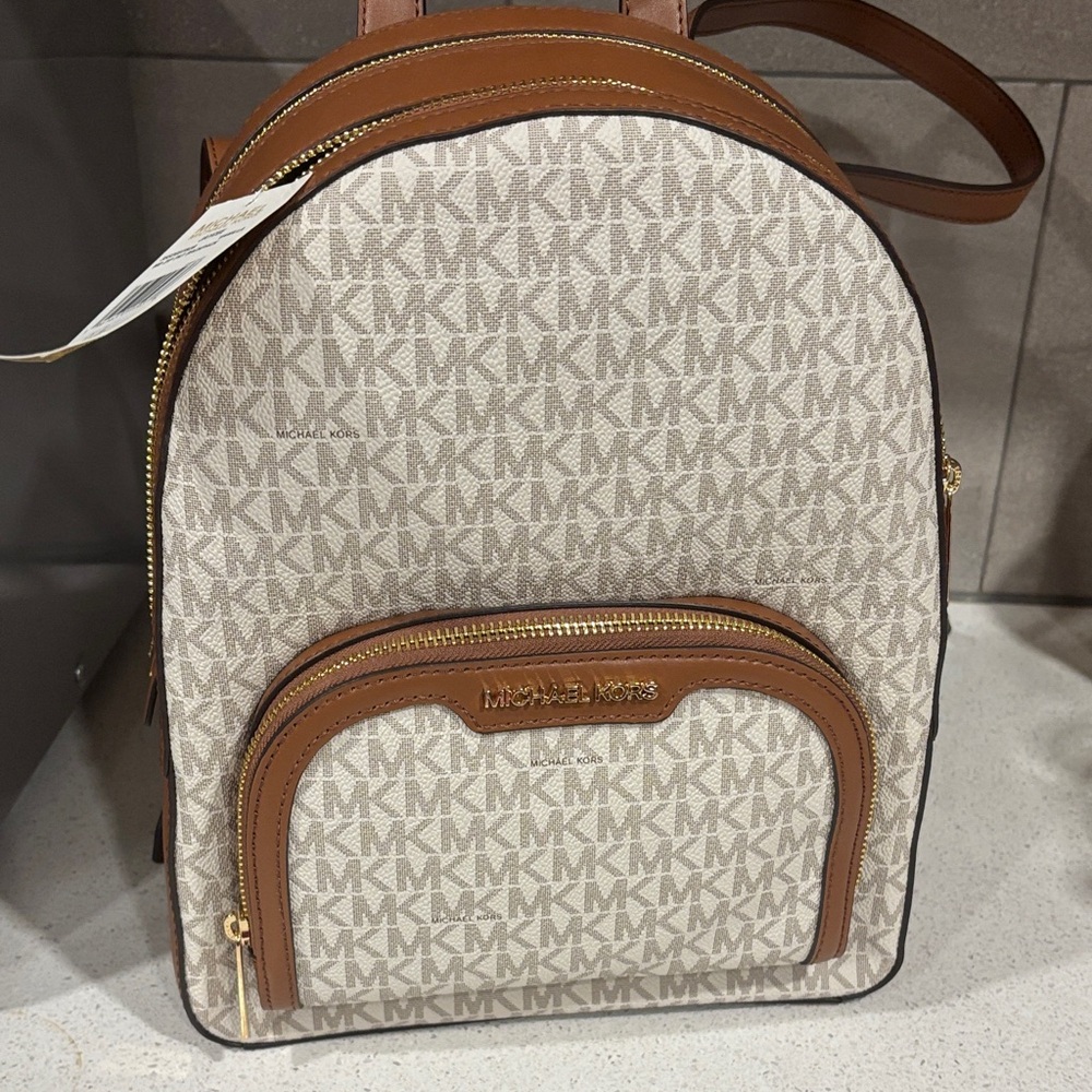 Michael Kors Tan and Cream Signature Backpack retails for $495